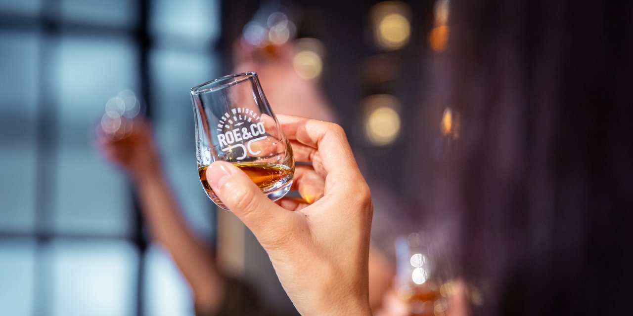 holding a glass of whiskey dublin ireland